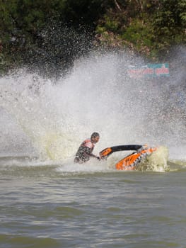 SARABURI THAILAND-JANUARY 20: Boonlue Korbangyang in action during show Freestyle the Jet ski  stunt action  on Jan 20, 2013 in SARABURI,Thailand.