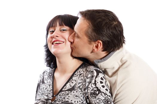 a man kissing a woman on a white background