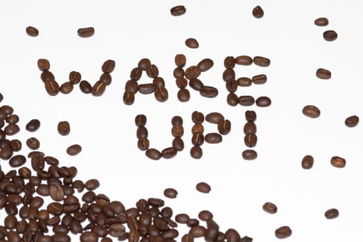 postcard with wake up phrase made of coffee beans