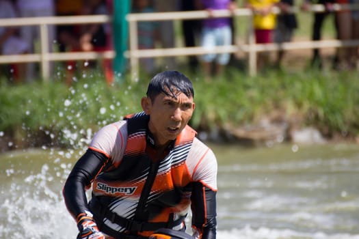 SARABURI THAILAND-JANUARY 20: Boonlue Korbangyang in action during show Freestyle the Jet ski  stunt action  on Jan 20, 2013 in SARABURI,Thailand.