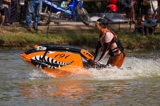 SARABURI THAILAND-JANUARY 20: Boonlue Korbangyang in action during show Freestyle the Jet ski  stunt action  on Jan 20, 2013 in SARABURI,Thailand.