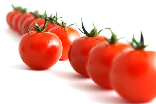 one step forward by one tomato, isolated on white