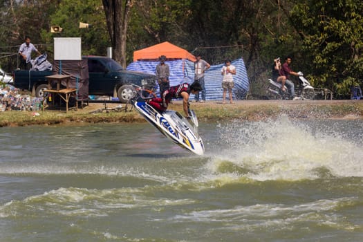 SARABURI THAILAND-JANUARY 20: Sonswut Rappasubpisan in action during show Freestyle the Jet ski  stunt action  on Jan 20, 2013 in SARABURI,Thailand.