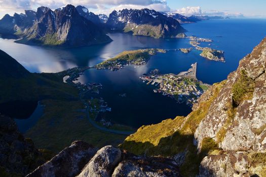 Scenic view of Lofoten islands from top of mountain Reinebringen with picturesque town of Reine and surrounding fjords