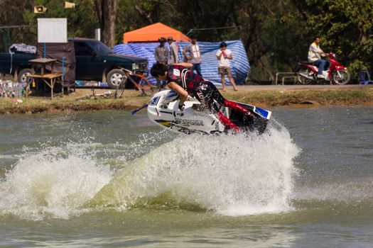SARABURI THAILAND-JANUARY 20: Sonswut Rappasubpisan in action during show Freestyle the Jet ski  stunt action  on Jan 20, 2013 in SARABURI,Thailand.