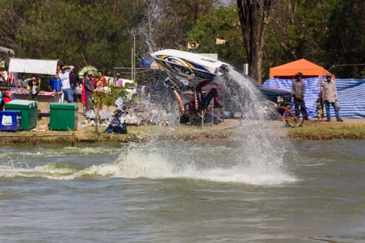 SARABURI THAILAND-JANUARY 20: Sonswut Rappasubpisan in action during show Freestyle the Jet ski  stunt action  on Jan 20, 2013 in SARABURI,Thailand.