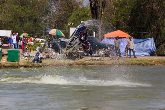 SARABURI THAILAND-JANUARY 20: Sonswut Rappasubpisan in action during show Freestyle the Jet ski  stunt action  on Jan 20, 2013 in SARABURI,Thailand.