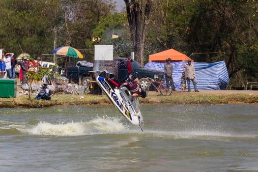 SARABURI THAILAND-JANUARY 20: Sonswut Rappasubpisan in action during show Freestyle the Jet ski  stunt action  on Jan 20, 2013 in SARABURI,Thailand.