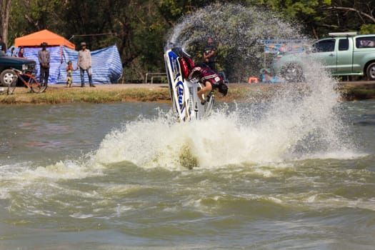 SARABURI THAILAND-JANUARY 20: Sonswut Rappasubpisan in action during show Freestyle the Jet ski  stunt action  on Jan 20, 2013 in SARABURI,Thailand.