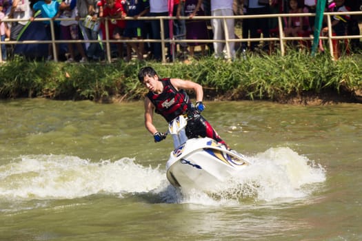 SARABURI THAILAND-JANUARY 20: Sonswut Rappasubpisan in action during show Freestyle the Jet ski  stunt action  on Jan 20, 2013 in SARABURI,Thailand.