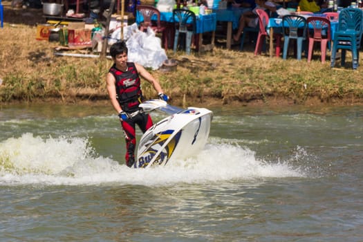 SARABURI THAILAND-JANUARY 20: Sonswut Rappasubpisan in action during show Freestyle the Jet ski  stunt action  on Jan 20, 2013 in SARABURI,Thailand.