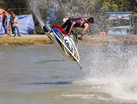 SARABURI THAILAND-JANUARY 20: Sonswut Rappasubpisan in action during show Freestyle the Jet ski  stunt action  on Jan 20, 2013 in SARABURI,Thailand.
