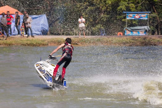 SARABURI THAILAND-JANUARY 20: Sonswut Rappasubpisan in action during show Freestyle the Jet ski  stunt action  on Jan 20, 2013 in SARABURI,Thailand.