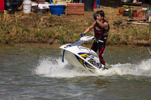 SARABURI THAILAND-JANUARY 20: Sonswut Rappasubpisan in action during show Freestyle the Jet ski  stunt action  on Jan 20, 2013 in SARABURI,Thailand.