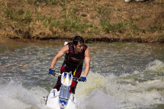 SARABURI THAILAND-JANUARY 20: Sonswut Rappasubpisan in action during show Freestyle the Jet ski  stunt action  on Jan 20, 2013 in SARABURI,Thailand.