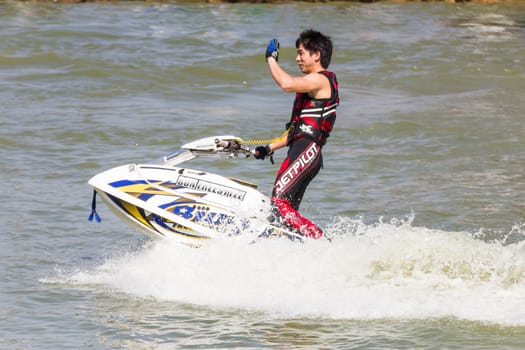 SARABURI THAILAND-JANUARY 20: Sonswut Rappasubpisan in action during show Freestyle the Jet ski  stunt action  on Jan 20, 2013 in SARABURI,Thailand.
