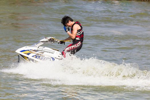 SARABURI THAILAND-JANUARY 20: Sonswut Rappasubpisan in action during show Freestyle the Jet ski  stunt action  on Jan 20, 2013 in SARABURI,Thailand.