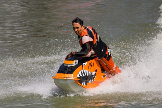 SARABURI THAILAND-JANUARY 20: Boonlue Korbangyang in action during show Freestyle the Jet ski  stunt action  on Jan 20, 2013 in SARABURI,Thailand.