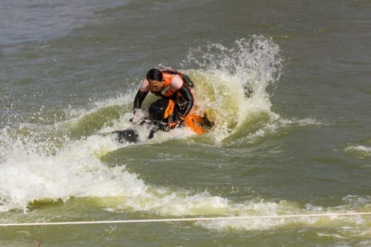 SARABURI THAILAND-JANUARY 20: Boonlue Korbangyang in action during show Freestyle the Jet ski  stunt action  on Jan 20, 2013 in SARABURI,Thailand.