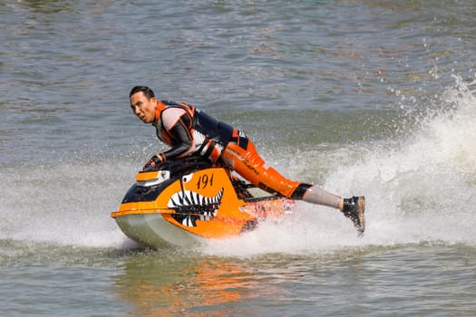 SARABURI THAILAND-JANUARY 20: Boonlue Korbangyang in action during show Freestyle the Jet ski  stunt action  on Jan 20, 2013 in SARABURI,Thailand.