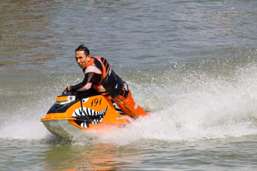 SARABURI THAILAND-JANUARY 20: Boonlue Korbangyang in action during show Freestyle the Jet ski  stunt action  on Jan 20, 2013 in SARABURI,Thailand.