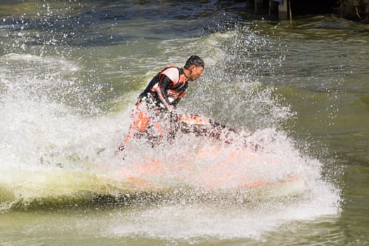 SARABURI THAILAND-JANUARY 20: Boonlue Korbangyang in action during show Freestyle the Jet ski  stunt action  on Jan 20, 2013 in SARABURI,Thailand.