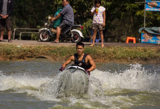 SARABURI THAILAND-JANUARY 20: Veerapong Maneechom in action during show Freestyle the Jet ski  stunt action  on Jan 20, 2013 in SARABURI,Thailand.
