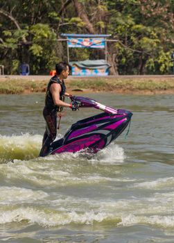 SARABURI THAILAND-JANUARY 20: Somchai Sae-Tang in action during show Freestyle the Jet ski  stunt action  on Jan 20, 2013 in SARABURI,Thailand.