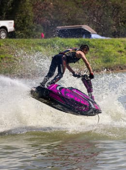 SARABURI THAILAND-JANUARY 20: Somchai Sae-Tang in action during show Freestyle the Jet ski  stunt action  on Jan 20, 2013 in SARABURI,Thailand.