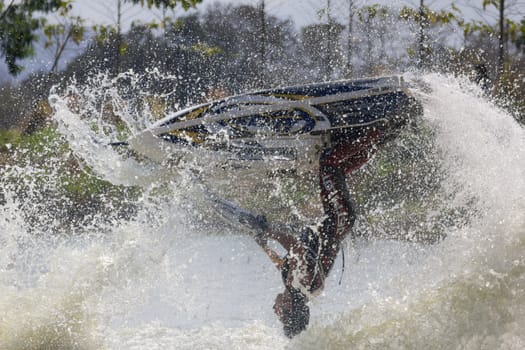 SARABURI THAILAND-JANUARY 20: Sonswut Rappasubpisan in action during show Freestyle the Jet ski  stunt action  on Jan 20, 2013 in SARABURI,Thailand.