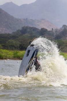 SARABURI THAILAND-JANUARY 20: Sonswut Rappasubpisan in action during show Freestyle the Jet ski  stunt action  on Jan 20, 2013 in SARABURI,Thailand.