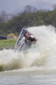 SARABURI THAILAND-JANUARY 20: Sonswut Rappasubpisan in action during show Freestyle the Jet ski  stunt action  on Jan 20, 2013 in SARABURI,Thailand.