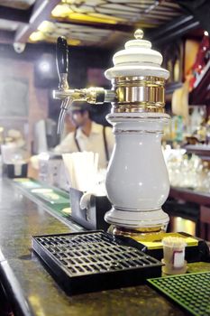 Vertical take of a beer pump, nozzle back to front to allow customers to self serve. Generic shot location India