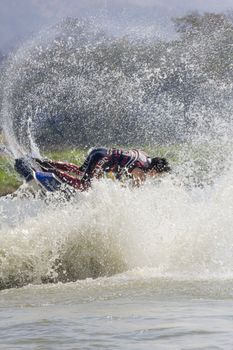 SARABURI THAILAND-JANUARY 20: Sonswut Rappasubpisan in action during show Freestyle the Jet ski  stunt action  on Jan 20, 2013 in SARABURI,Thailand.