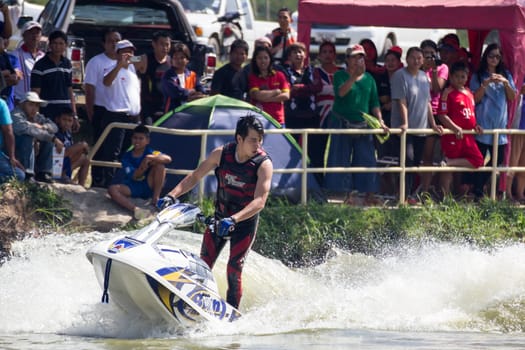SARABURI THAILAND-JANUARY 20: Sonswut Rappasubpisan in action during show Freestyle the Jet ski  stunt action  on Jan 20, 2013 in SARABURI,Thailand.