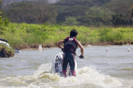 SARABURI THAILAND-JANUARY 20: Sonswut Rappasubpisan in action during show Freestyle the Jet ski  stunt action  on Jan 20, 2013 in SARABURI,Thailand.