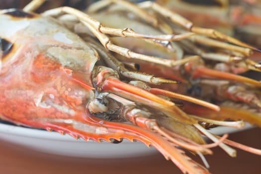 Grilled shrimp are placed on a plate