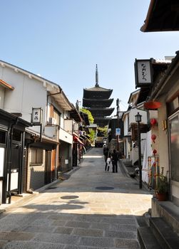 KYOTO, JAPAN - OCT 21 2012: Tourists walk on a street leading to Kiyomizu Temple on October 21 2012. Kiyomizu is a famous temple in Kyoto built in year 778.