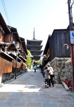 KYOTO, JAPAN - OCT 21 2012: Tourists walk on a street leading to Kiyomizu Temple on October 21 2012. Kiyomizu is a famous temple in Kyoto built in year 778.