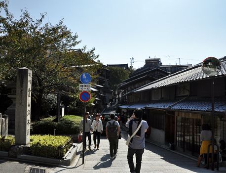 KYOTO, JAPAN - OCT 21 2012: Tourists walk on a street leading to Kiyomizu Temple on October 21 2012. Kiyomizu is a famous temple in Kyoto built in year 778.