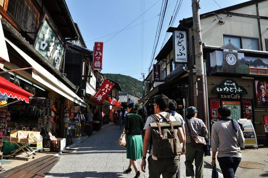 KYOTO, JAPAN - OCT 21 2012: Tourists walk on a street leading to Kiyomizu Temple on October 21 2012. Kiyomizu is a famous temple in Kyoto built in year 778.
