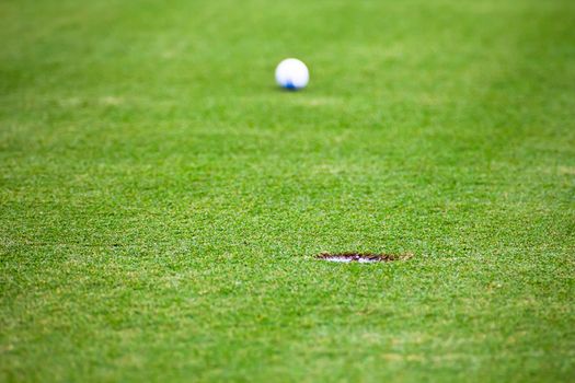 Golf ball very close to the hole