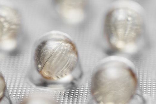 Macro photo of pills in packaging.