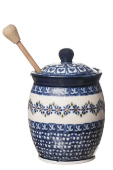 Rustic honey pot on white background.