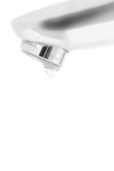 Macro photo of chrome tap. White background.