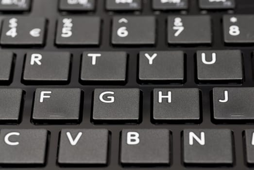 Detail of black laptop keyboard.