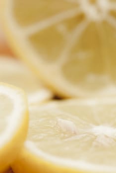 Cross section of sliced lemon on chopping board.