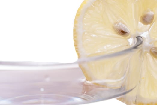 Cross section of sliced lemon in a glass.