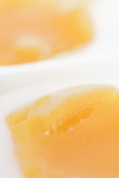 Macro photo of two halves of a boiled egg.