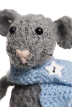 Grey handmade mouse using Crochet. Studio shot.